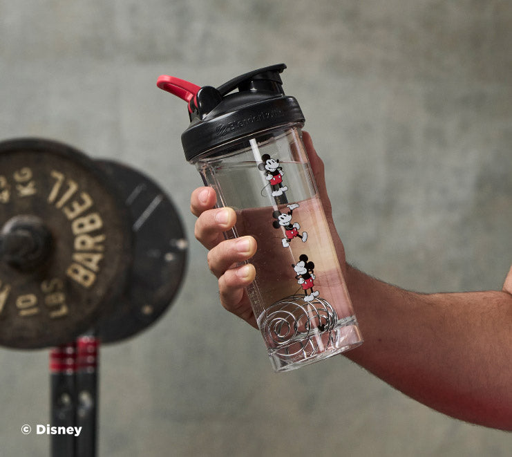 pro-series-j6 Mickey_Mouse_Protein_Shaker_Bottle_Being_Held_In_the_Gym.jpg
